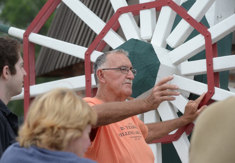 Dale Green, a volunteer miller for de Immigrant windmill in Fulton, talks to a tour group during the 25th anniversary celebration Saturday, June 7, 2025. Tours of the windmill were one of the activities offered during the day.
