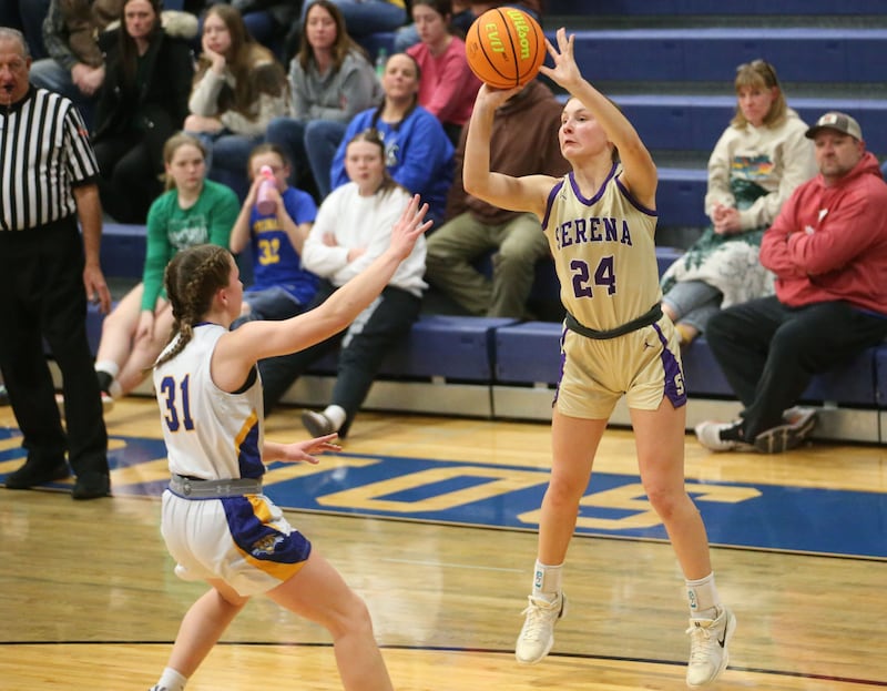 Serena's Anna Hjerpe (24) lofts a jumper over the outstretched arms of Somonauk/Leland defender Allayna Wold during a 2024-25 Little Ten Conference game at Somonauk High School.