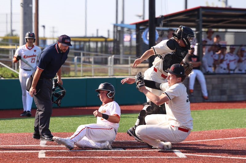 Minooka's Jason Duy slides safely into home as Bradley-Bourbonnais pitcher Liam Martin and catcher Cody Youngblood collide during Minooka's 12-3 victory in the Class 4A Bradley-Bourbonnais Regional semifinals on Wednesday, May 27, 2026.