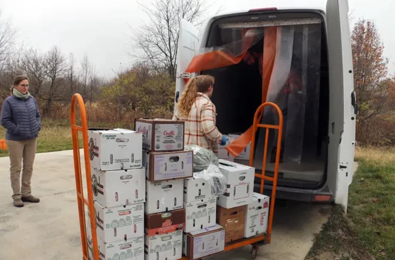 Traci Barkley, director of Sola Gratia Farm, watches as staff load produce into the farm’s refrigerated delivery van, which was purchased with the support of funding from the Illinois’ Local Food Infrastructure Grant program.