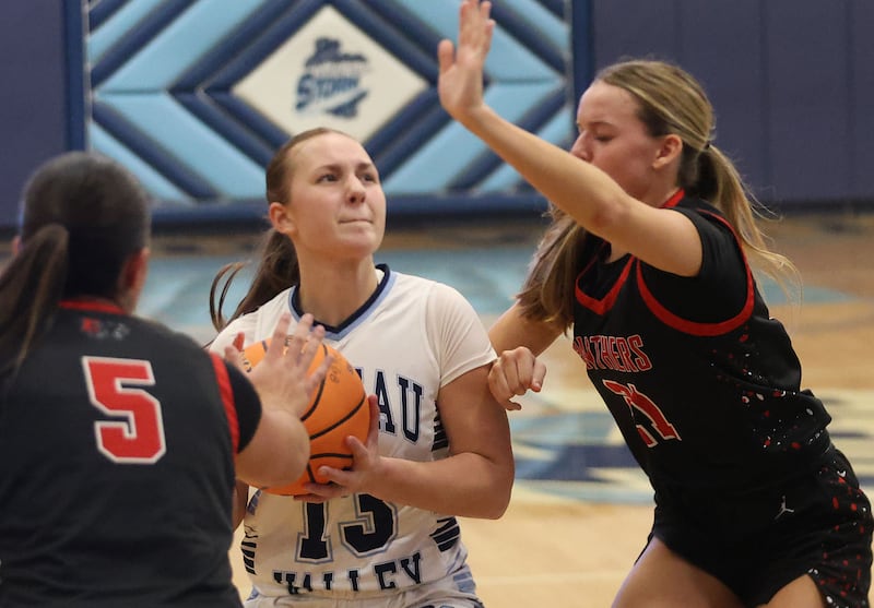 Bureau Valley's Libby Endress, looks to split Erie-Prophetstown defenders Ashlyn Johnson and Aubrey Huisman during the Thanksgiving Tournament on Wednesday, Nov. 19, 2025 at Bureau Valley High School.