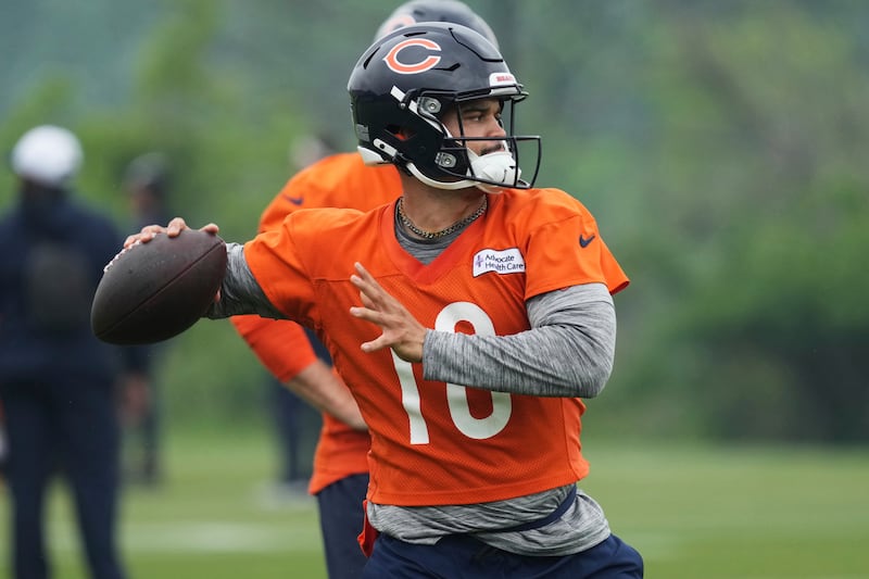 Chicago Bears quarterback Caleb Williams throws a pass during NFL football practice at Halas Hall in Lake Forest, Ill., Wednesday, June 4, 2025. (AP Photo/Nam Y. Huh)