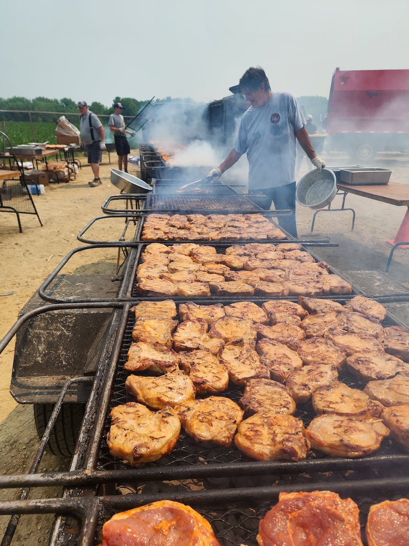 Mike Herbert manning the grills at Fay's finest Foods with Timothy and Jim Fay at far left. The company will provide chicken, pork chop and walleye dinners from 3 to 7 p.m. Thursday, July 3 for a scholarship fundraiser the Kane County Farm Bureau, 2N710 Randall Road, St. Charles.
