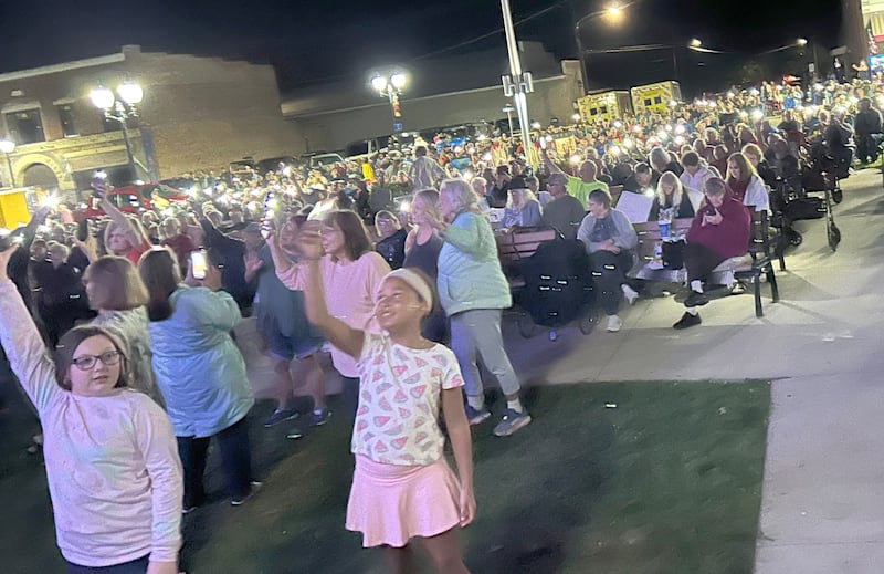 An estimated crowd of 2,500 turned out to listen to Fortunate Sons, a Creedence Clearwater tribute band, on Friday, Aug, 29, 2025 in Mt. Morris. Concertgoers used their cell phone flashlights during the song "Long As I Can See the Light".