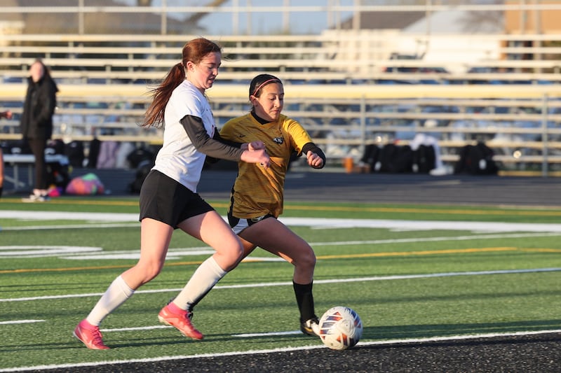 Herscher's Gianni Jaime approaches the goal as Bradley-Bourbonnais' Marti Grizzle, left, defends her during the Tigers' 3-2 victory over the Boilermakers on Tuesday, April 15, 2025.