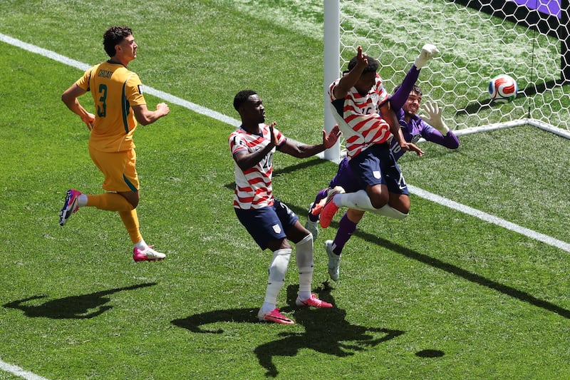 United States' Alex Freeman (16) heads the ball for a goal past Australia goalkeeper Patrick Beach (18) during the World Cup Group D soccer match between the United States and Australia in Seattle, Friday, June 19, 2026. (AP Photo/Maddy Grassy)
