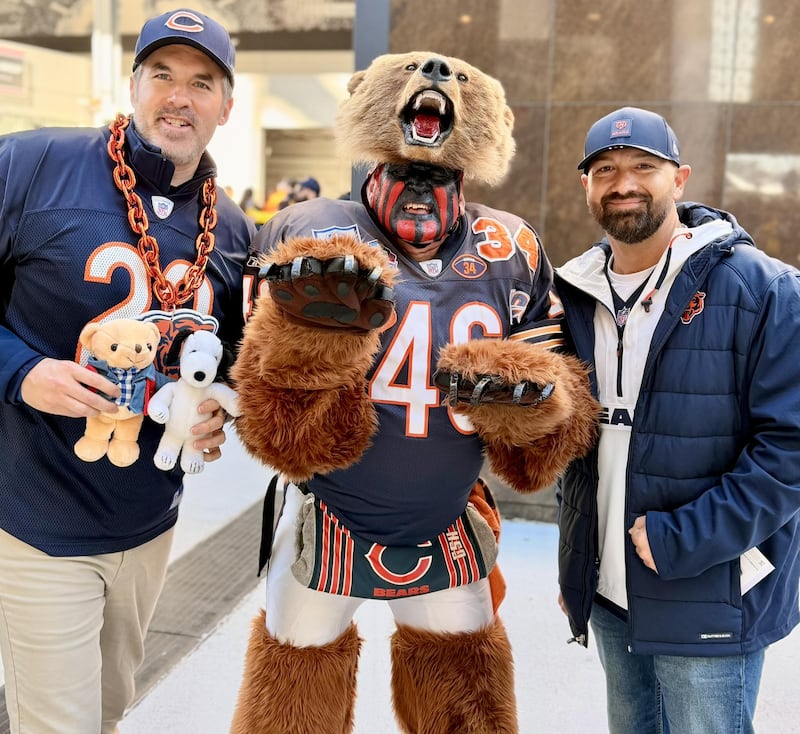 Plainfield resident Don Wachter, known as the Bearman, visits with Chicago Bears fans.