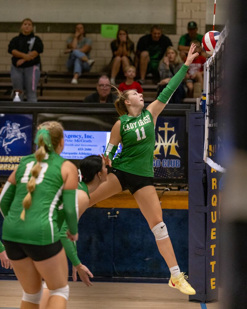 Franki Meyers spikes the ball over the net against Marquette during the match at Bader Gym on September 25, 2025 at Marquette High School