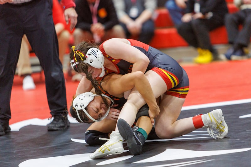 Batavia's Lily Enos and Wheaton Warrenville's Andrea James - Alvarez compete in the championship 100 lb class at the East Aurora Wrestling Regional on Saturday, Feb.7,2026 in Aurora.