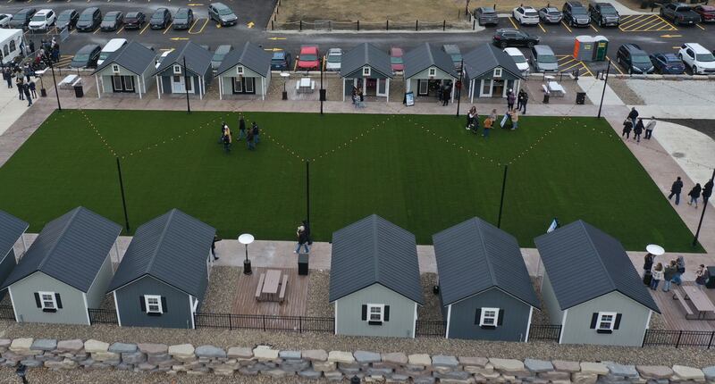 Wine enthusiasts attend the Winter Wine Walk on Saturday, Feb. 8, 2025 at the Market on Mill plaza in Utica.