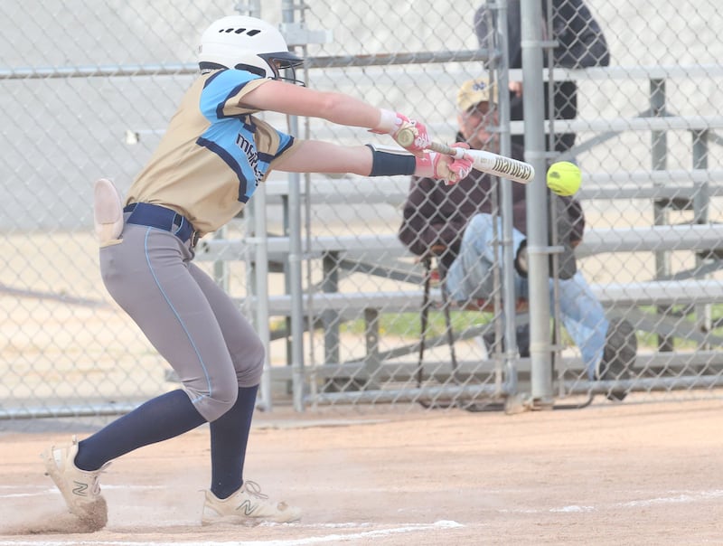 Marquette's Hunter Hopkins slaps at a pitch from Putnam County's Myah Richardson on Tuesday, April 29, 2025, in Ottawa.