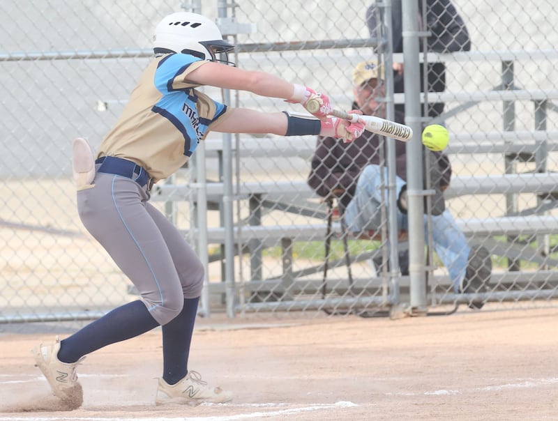 Marquette's Hunter Hopkins slaps at a pitch from Putnam County's Myah Richardson on Tuesday, April 29, 2025, in Ottawa.