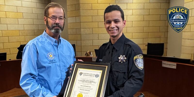 Kendall Wilson, chair of the Montgomery Fire and Police Commissioners, presents Officer Isaiah Rodriguez with his certificate at the Monday, Jan. 12, 2026, Montgomery Village Board meeting.