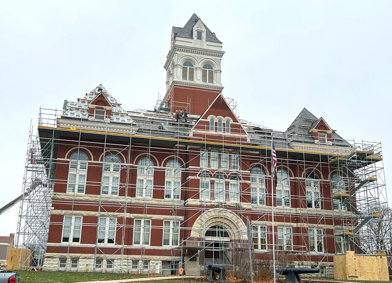 Scaffolding surrounds the historic Ogle County Courthouse in Oregon as Sterling Commercial Roofing workers remove slate shingles from the 134-year-old structure on Wednesday, Nov. 19, 2025.