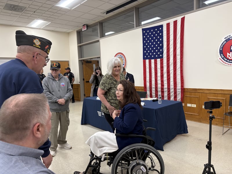 U.S. Sen. Tammy Duckworth greets constituents before a town hall May 17, 2025.