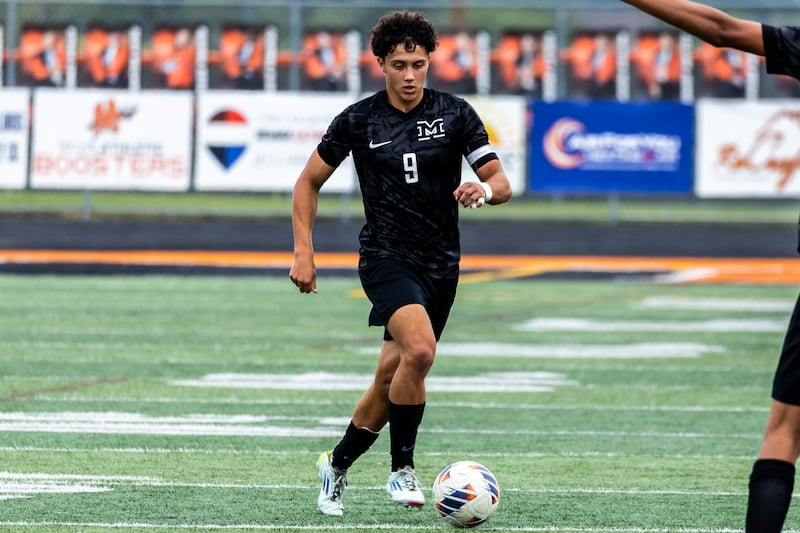 Minooka's Andrew Calderon takes control of the ball during a varsity soccer home game against Romeoville on Sept. 23, 2025.