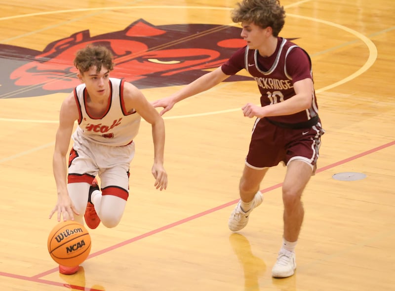 Hall's Jacob Andracke sprints down the court against Rockridge's Rylan Daly during the Class 2A Regional quarterfinal game on Monday, Feb. 23, 2026 at Hall High School.