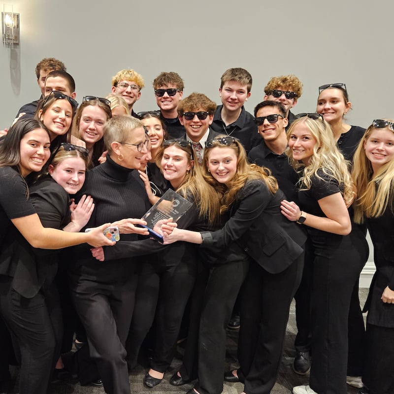 The Sauk Valley Area Chamber of Commerce recognized LeAndra Hartman (front row, third from left) as the recipient of the 2025 Chamber Champion Award. Here, Hartman is shown with students after receiving the award Thursday night at the McCormick Event Center.