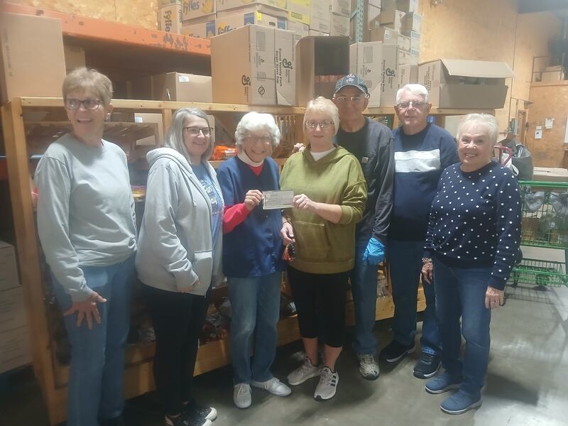 Lori Mahan and Marla Merritt presented a $950.50 check to the Streatorland Food Pantry. Pictured from left are Karen Dzurison, a volunteer; Merritt; Bertie Beckman, board president; Mahan; Jack Dzurison, volunteer; and board members John Mauser and Irene Grebe.