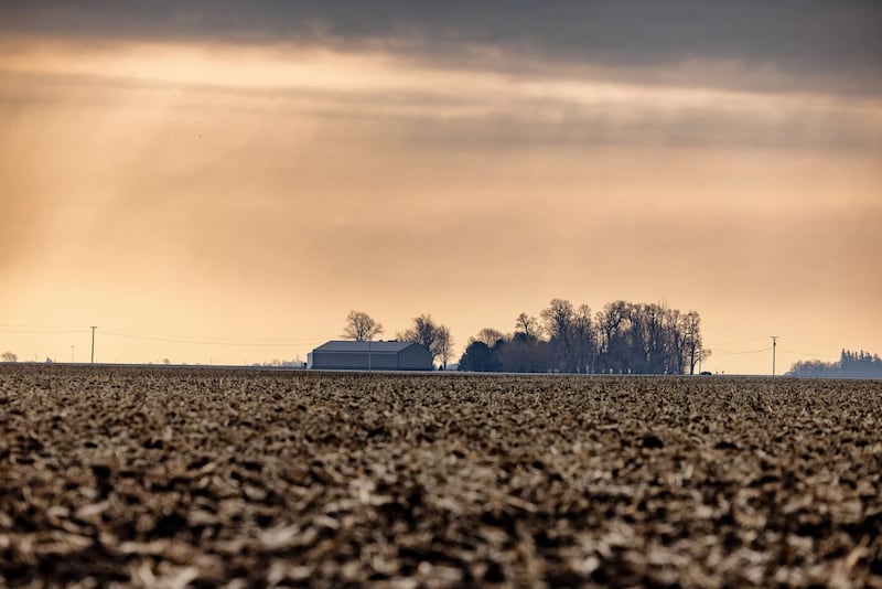 Sunlight pokes through cloudy skies over an Illinois farm. Despite recent rains, drought and dryness remain a top concern following a wild weather year that wound up historically dry in Illinois.
