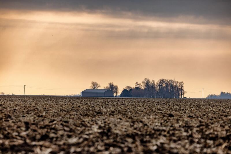 Sunlight pokes through cloudy skies over an Illinois farm. Despite recent rains, drought and dryness remain a top concern following a wild weather year that wound up historically dry in Illinois.