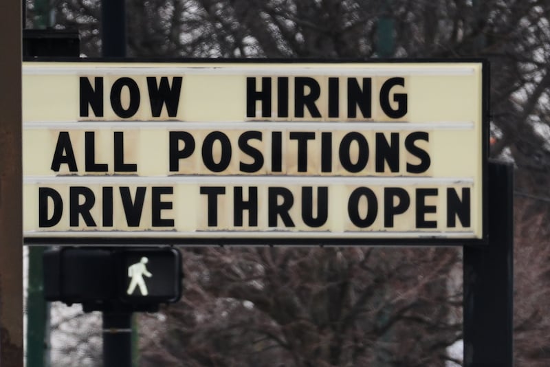 Hiring sign is displayed in front of a restaurant in Chicago, Thursday, Feb. 5, 2026. (AP Photo/Nam Y. Huh)