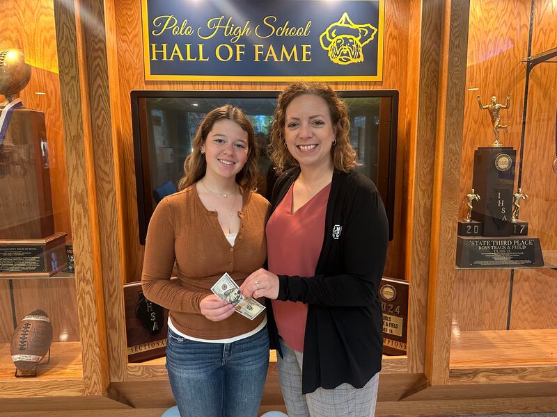 September Polo Community High School Student of the Month Lydia Anderson (left) and Jen Grobe from the Polo School Foundation celebrate Anderson's accomplishment.