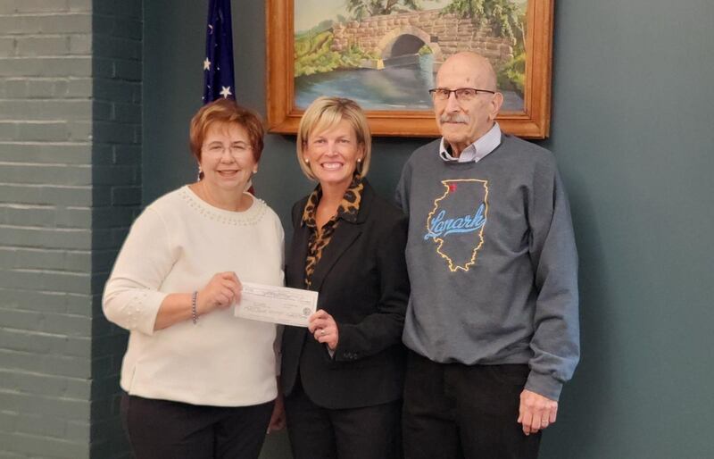 City of Lanark Mayor Jeri Rogan, House Minority Leader Tony McCombie and former Mayor of Lanark, Ken Viglietta (left to right) gather Wednesday, March 4, 2026, to celebrate the presentation of $112,500 in capital infrastructure funds for the city, which was used to fund improvements to the water infrastructure system.