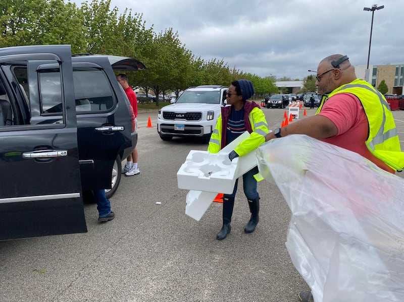 Volunteers unload a truck at the 2024 Recyclepalooza event in Joliet.