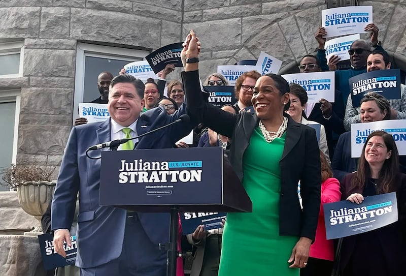 Gov. JB Pritzker, left, celebrates with Lt. Gov. Juliana Stratton, right, after announcing he will endorse his governing partner in the 2026 Democratic primary for one of Illinois’ U.S. Senate seats.