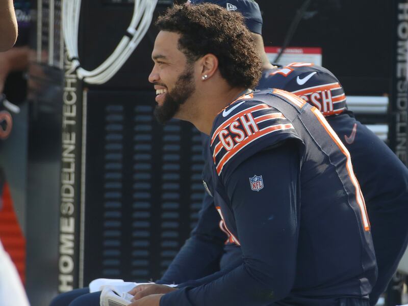 Chicago Bears quarterback Caleb Williams smiles on the bench in the closing minutes after defeating the Carolina Panthers on Sunday, Oct. 6, 2024 at Soldier Field in Chicago.