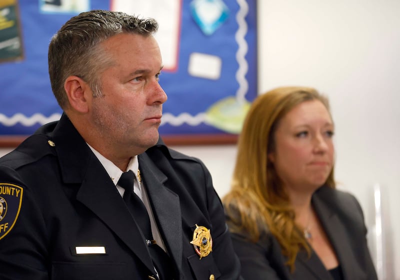 Kane County Sheriff Ron Hain and Kane County State's Attorney Jamie Mosser watch body and vehicle cameras during a press conference Friday, April 11, 2025 at the Kane County Sheriff's Office in St. Charles Ill from an altercation where three Kane County deputies were justified when they shot and killed James Moriarty on May 24, 2023 on Randall Road in Batavia.