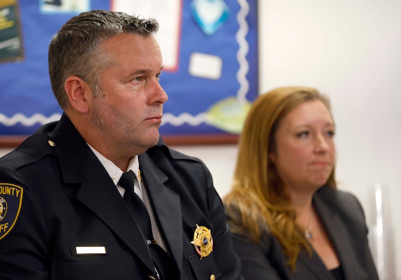 Kane County Sheriff Ron Hain and Kane County State's Attorney Jamie Mosser watch body and vehicle cameras during a press conference Friday, April 11, 2025 at the Kane County Sheriff's Office in St. Charles Ill from an altercation where three Kane County deputies were justified when they shot and killed James Moriarty on May 24, 2023 on Randall Road in Batavia.