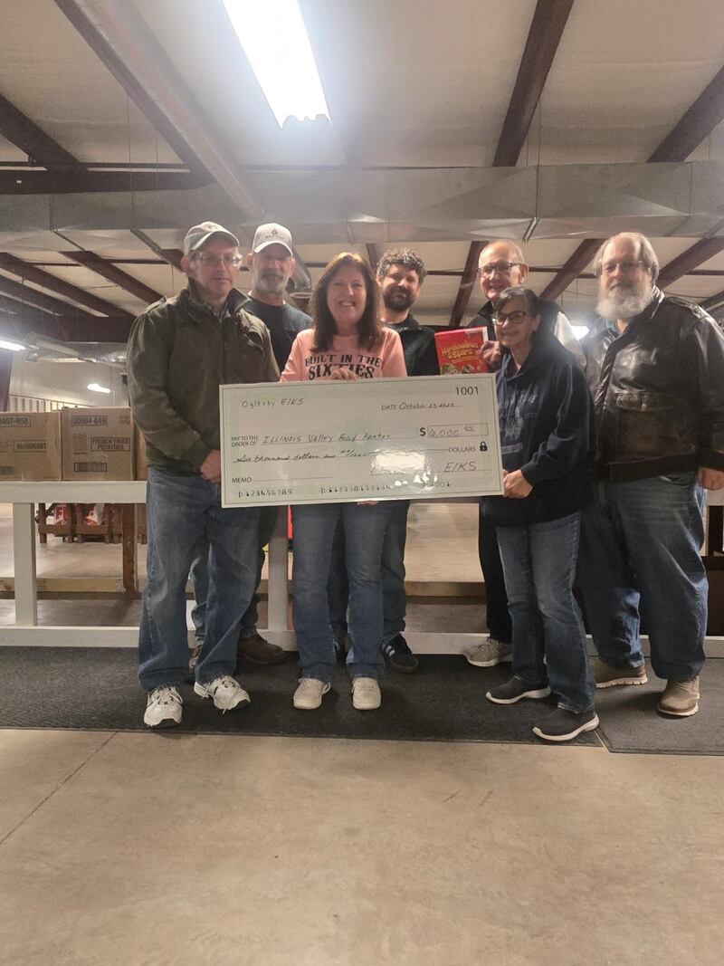 Oglesby Elks presented a $6,000 check to Illinois Valley Food Pantry in Peru. Pictured from left are Elk members Tim Watkins and Junior Metcalf, food pantry executive director Mary Jo Crei, and Elks Lee Thompson, Ken Ficek, Sarah Metcalf and Gary Ferrari.