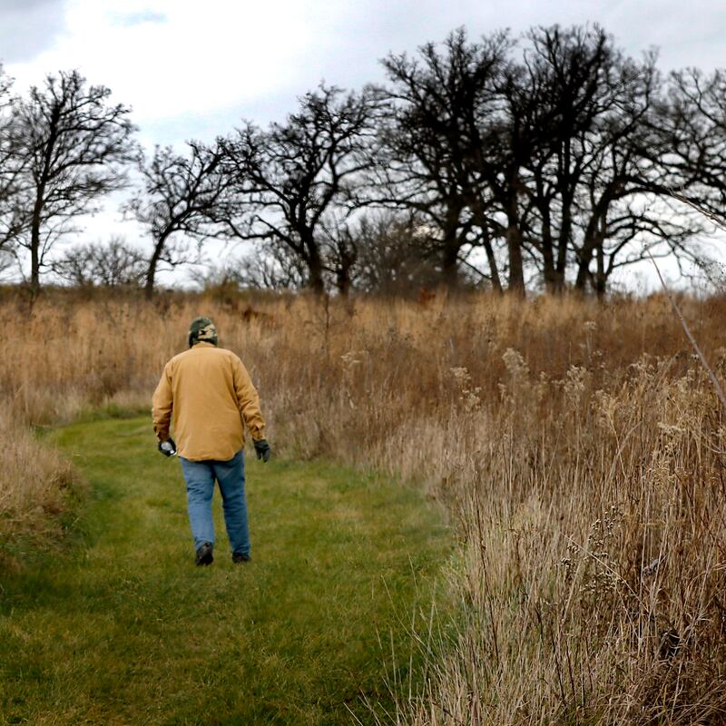 A man hikes through the McHenry County Conservation District's Glacier Park Conservation Area on Wednesday, Nov. 20, 2024, near Ringwood. According to unofficial election results, voters approved the McHenry County Conservation District’s referendum seeking to increase property taxes.