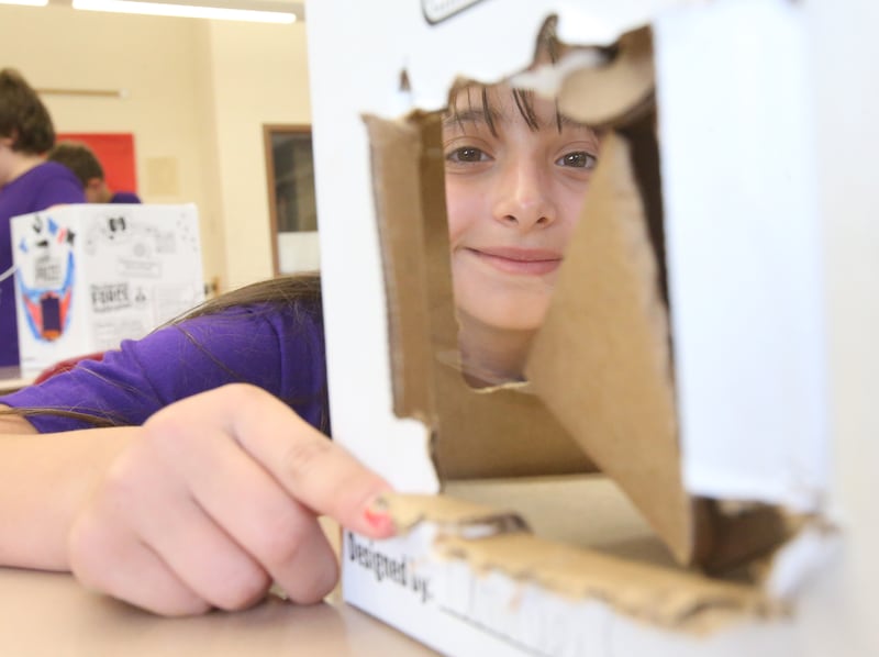 Annie makes final adjustments on her claw machine project during Inventor Camp on Friday, June 13, 2025 at Central Intermediate School in Ottawa.