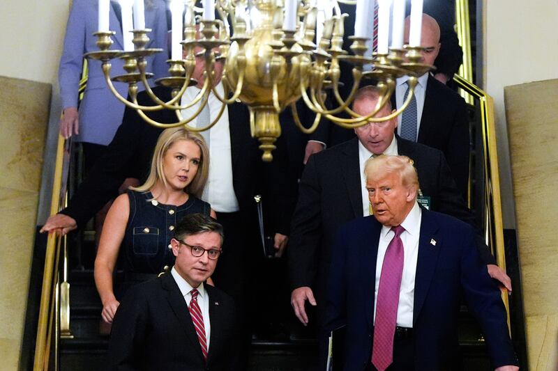 Speaker of the House Mike Johnson, R-La., and President Donald Trump arrive for a House Republican conference meeting, Tuesday, May 20, 2025, at the U.S. Capitol in Washington. (AP Photo/Julia Demaree Nikhinson)