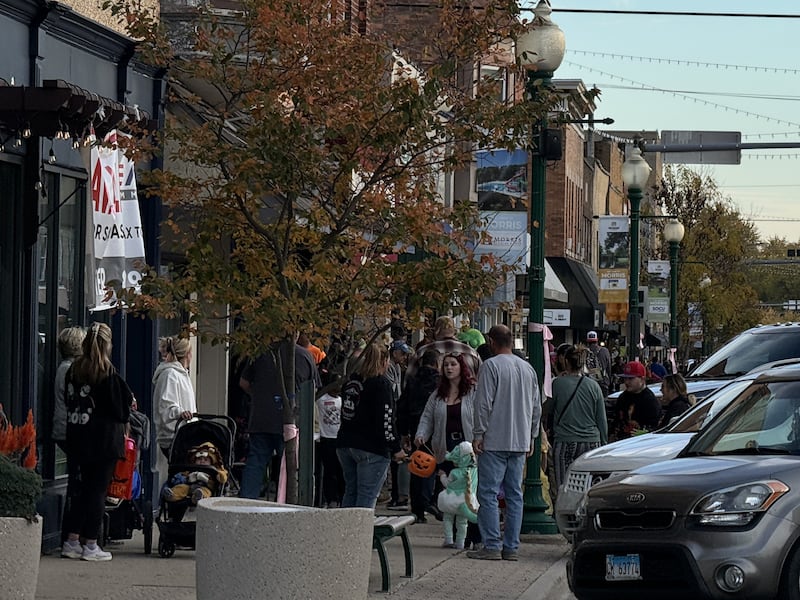 Trick-or-treaters and their parents flood Liberty Street in Morris in pursuit of candy Thursday night for Downtown Trick-or-Treat.