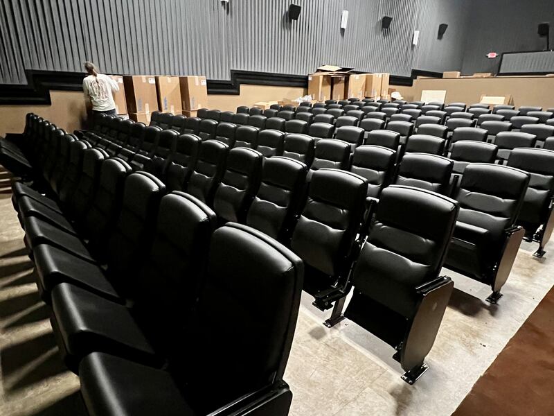 A worker assembles the new seating at the Sterling Theater in Sterling, Illinois.