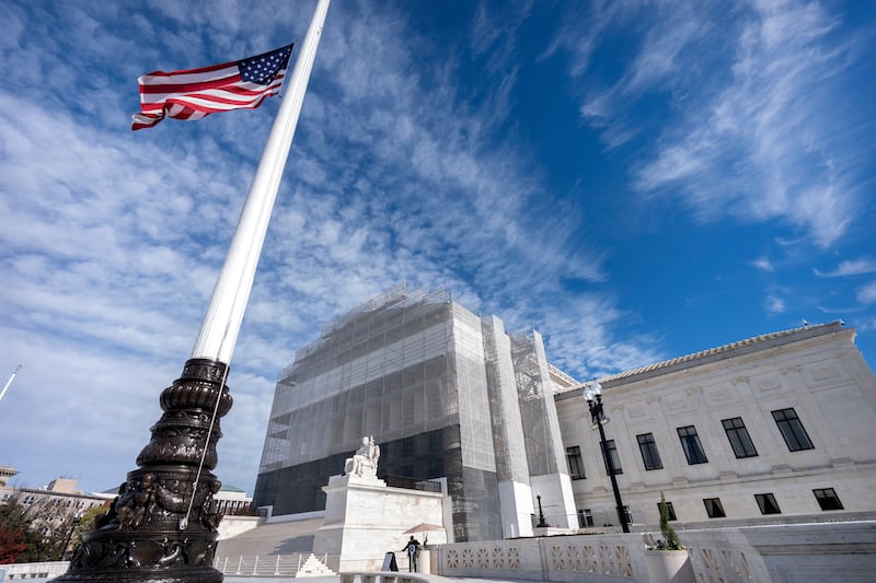 FILE -An American flag flies at half-staff outside the Supreme Court Nov. 5, 2025, in Washington. (AP Photo/Mark Schiefelbein, File)