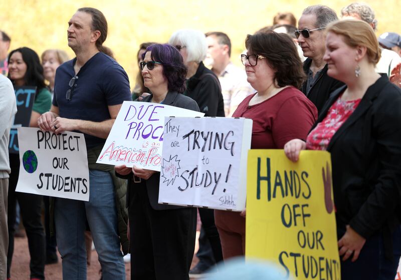 Attendees listen to speakers Wednesday, April 23, 2025, during a rally to support Northern Illinois University’s international students, faculty and staff, in front of Founders Memorial Library at NIU in DeKalb.
