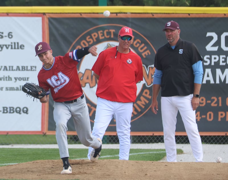 Lockport's Trace Shaaf warms up for the 49th annual Illinois High School Baseball Coaches Association (IHSBCA) All-Star Game as Red Team coach Matt McDonald watches Monday, June 22, 2026, at Schweickert Stadium in Peru.