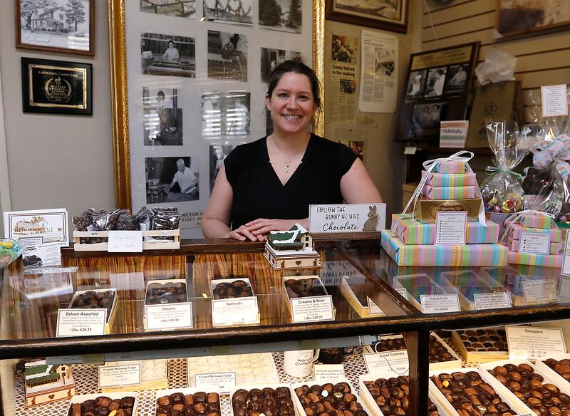 Katie Anderson-Tedder is shown with some of the history to her family’s candy shop on Thursday, March 27, 2025, at Anderson's Candy Shop in Richmond.