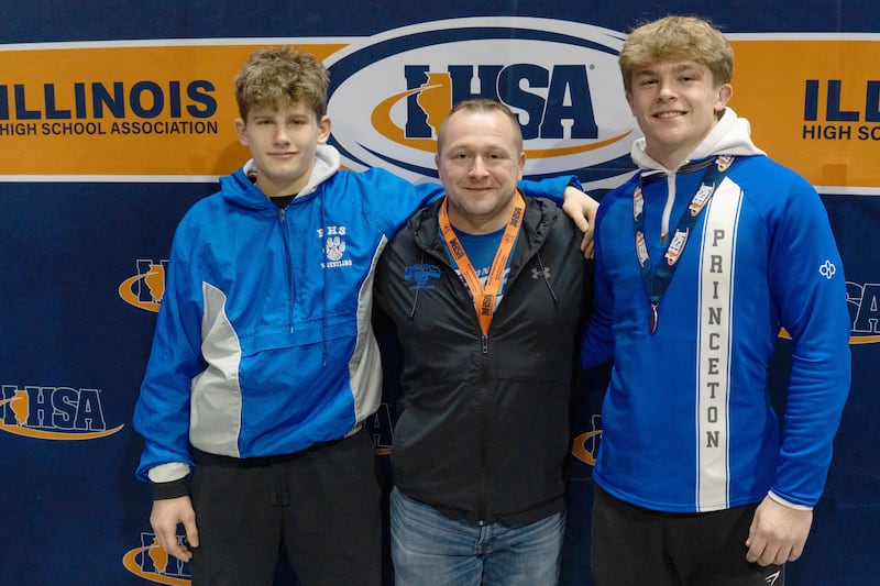 Princeton wrestling coach Steve Amy (center) poses for a photo with Tiger medalists Kane Dauber (left, 5th, 132) and Casey Etheridge (4th, 165) on Saturday, Feb. 22, 2025 in Champaign.