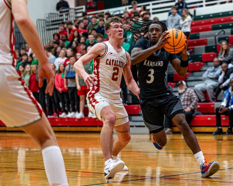 Kaneland's Marshawn Cocroft (3) drives ball in lane whilst being guarded by LaSalle-Peru's Regan Doerr (2) on Friday, Feb. 20, 2026 in Sellett Gymnasium at L-P High School.
