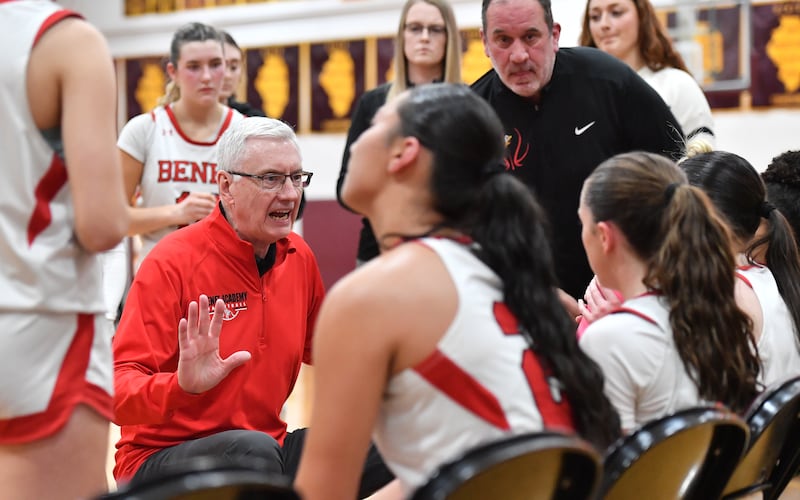 Benet Academy girls basketball coach Joe Kilbride instructs his team during a timeout in the Montini Christmas Tournament championship game against Marist on December 27, 2025 at Montini Catholic High School in Lombard.