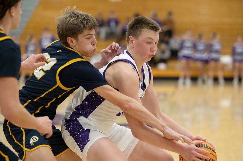 Rochelle’s Eli Schweitzer handles the ball against Sterling’s Jack Saathoff Saturday, Jan. 3, 2026.