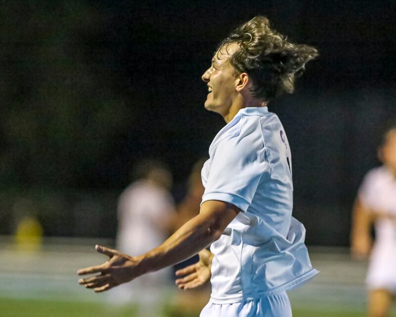 Downers Grove North's Ty Peboontom (9) celebrates his goal during soccer match between Downers Grove North at Downers Grove South. Oct 2, 2025.