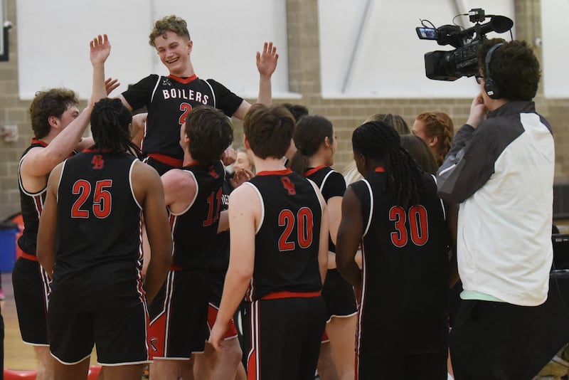 Bradley-Bourbonnais' Nate Corder (2) is hoisted by teammate Mason Shaul as the Boilermakers celebrate their 43-34 win over Mt. Vernon in the IHSA Special Olympics Unified Basketball Division 1 State championship Saturday, March 15, 2025 at the University of Illinois Activities and Recreation Center.