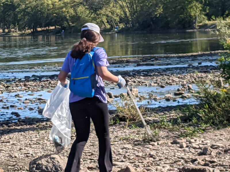 Oswego High School freshman Lara Kattoum and others were picking up trash on Sept. 21 in the Oswegoland Park District’s Veterans Serenity Park along the Fox River as part of It’s Our Fox River Day. The annual event is coordinated by Friends of the Fox River.